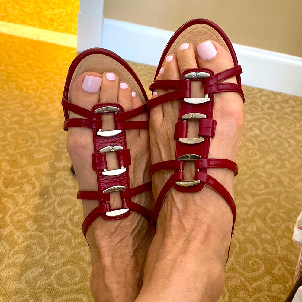 Vintage Chanel red sandals with silver accents.